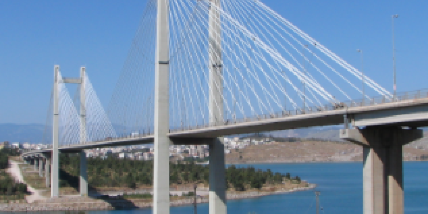 Multiple support seismic excitation of the Evripos bridge based on free-field and on-structure recordings